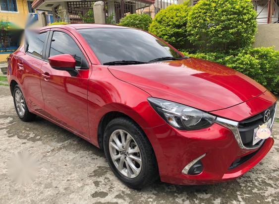 Red Mazda 2 for sale in Pacita Complex