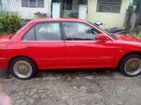 Sedan Mitsubishi Lancer 1995 model (red) for sale