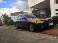 Mazda 323 Rayban Gen 2.5 MT Brown For Sale 