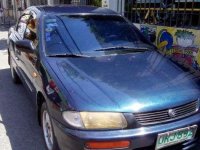 Mazda Familia car 4 door 1997