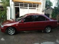 Selling lady driveN Mazda Familia 323 1996 