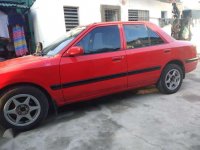 Mazda 323 sedan Good running condition