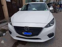 2016 Mazda 3 1.6L A/T. Arctic White color.