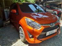 Selling Orange Toyota Wigo 2019 Manual Gasoline in Quezon City