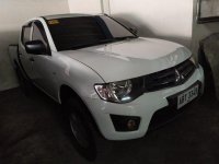 Selling White Mitsubishi Strada 2014 for sale in Pasig