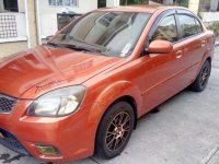 Selling Orange Kia Rio 2011 Automatic Gasoline in Quezon City