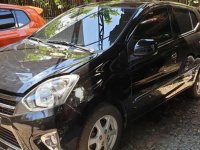 Selling Black Toyota Wigo 2014 Automatic Gasoline at 20000 km in Quezon City