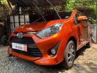 Selling Orange Toyota Wigo 2019 Hatchback Manual Gasoline in Quezon City