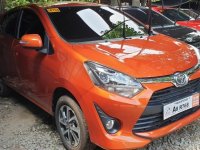 Selling Orange Toyota Wigo 2019 Manual Gasoline in Quezon City