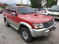 Selling Red Nissan Patrol 2001 at 141000 km 