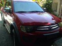 Red Mitsubishi Strada 2010 at 74000 km for sale in Cabuyao