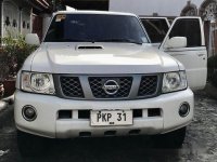 White Nissan Patrol 2013 at 157000 km for sale 
