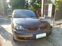 Sell Grey 2009 Mitsubishi Lancer in Quezon City
