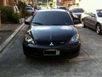 Sell Black 2009 Mitsubishi Lancer in Quezon City