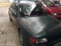 Sell Black Mazda 323 for sale in Valenzuela