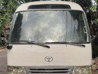 White Toyota Coaster 2008