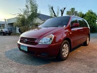 Red Kia Carnival 2.5 (A) 2009