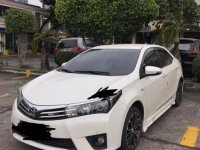 Selling Pearl White Toyota Corolla Altis 2015 in Bulacan