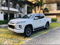 Pearl White Mitsubishi Strada 2019 for sale in Quezon 