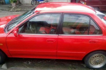 Sedan Mitsubishi Lancer 1995 model (red) for sale