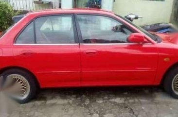 Sedan Mitsubishi Lancer 1995 model (red) for sale