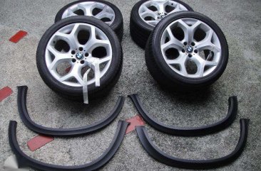 BMW X5 sets of tires and rims and fender flare