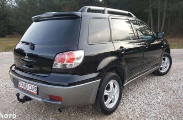 Looking for 2004-2005 Mitsubishi Outlander AT