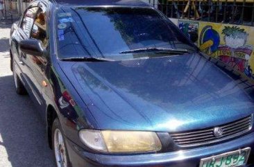 Mazda Familia car 4 door 1997