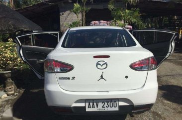 Mazda 2 Sedan white (slightly used) 2014 model