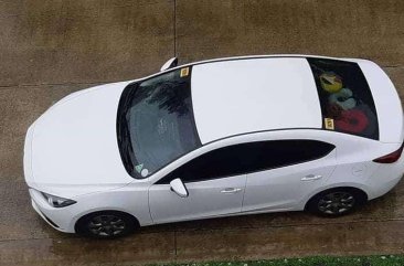 2016 Mazda 3 1.6L A/T. Arctic White color.