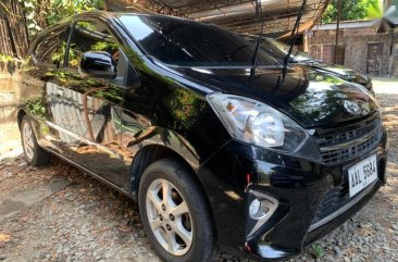 Selling Black Toyota Wigo 2014 Hatchback in Quezon City