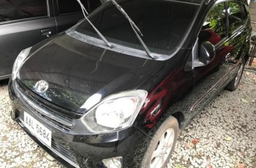 Selling Black Toyota Wigo 2014 in Quezon City