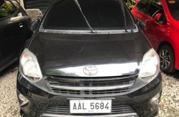 Selling Black Toyota Wigo 2014 in Quezon City
