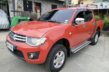 Selling Red Mitsubishi Strada 2014 at 49000 km in Quezon City