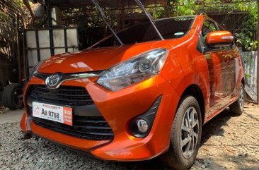 Selling Orange Toyota Wigo 2019 Hatchback Manual Gasoline in Quezon City