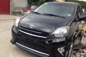 Black Toyota Wigo 2014 Hatchback for sale in Quezon City