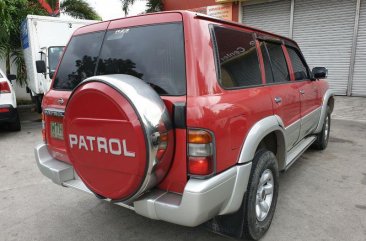 Selling Red Nissan Patrol 2001 at 141000 km 