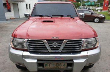 Selling Red Nissan Patrol 2001 at 141000 km 