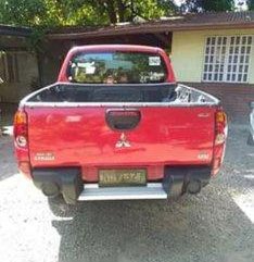 Red Mitsubishi Strada 2010 at 74000 km for sale in Cabuyao