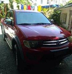 Red Mitsubishi Strada 2010 at 74000 km for sale in Cabuyao