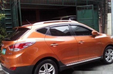 Orange Hyundai Tucson 2013 at 39125 km for sale