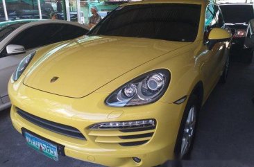 Yellow Porsche Cayenne 2012 at 14000 km for sale