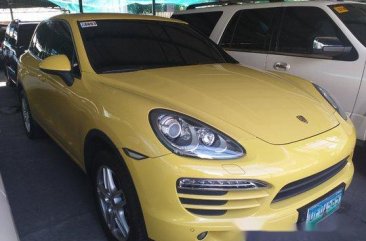 Yellow Porsche Cayenne 2012 at 14000 km for sale