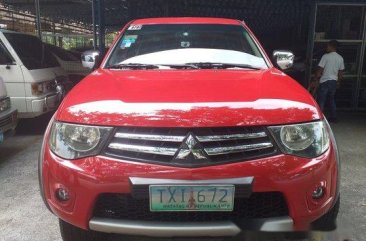 Red Mitsubishi Strada 2011 at 67256 km for sale