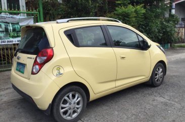 Yellow Chevrolet Spark 2013 Hatchback for sale in Manila 