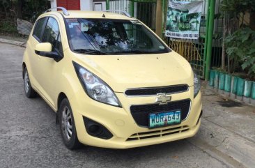 Yellow Chevrolet Spark 2013 Hatchback for sale in Manila 