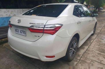 Selling White Toyota Corolla Altis 2018 Automatic Gasoline at 7000 km 