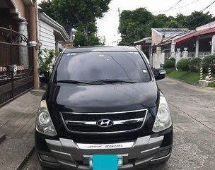 Black Hyundai Grand Starex 2010 at 150000 km for sale 