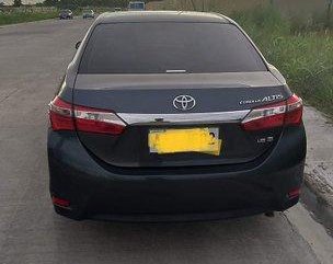 Selling Black Toyota Corolla Altis 2014 