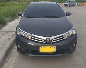 Selling Black Toyota Corolla Altis 2014 